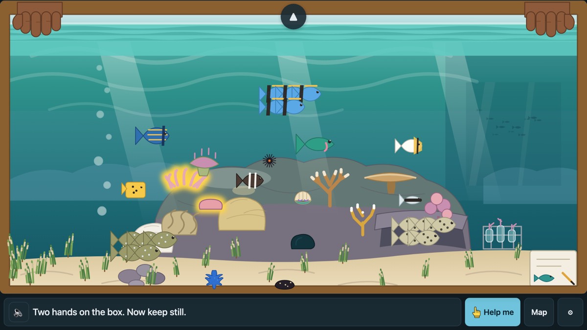 The Coast: a reef under clear water, seen through a look-box held in two hands, with corals and shoals of bright fish.
